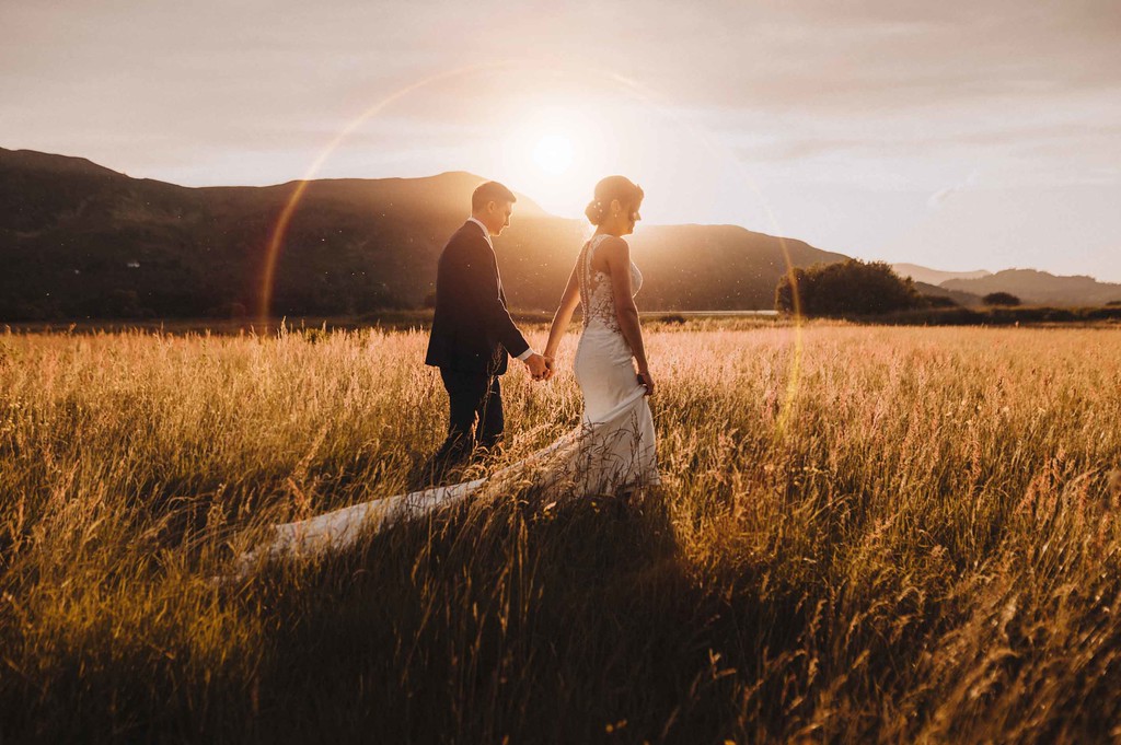 Couple walking in open field